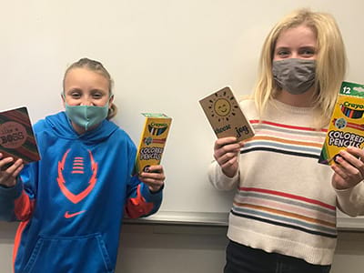 Albany middle school students with journals and colored pencils from Oregon State Credit Union's education grant